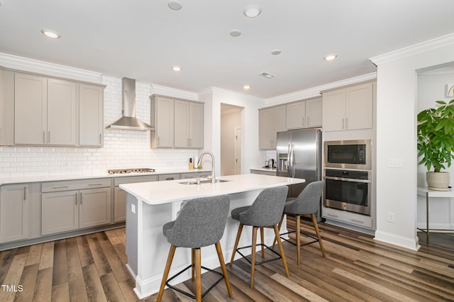 2128 Jollay St, Durham, NC 27703 - kitchen with stainless steel appliances, wall chimney exhaust hood, a sink, gray cabinetry, and crown molding