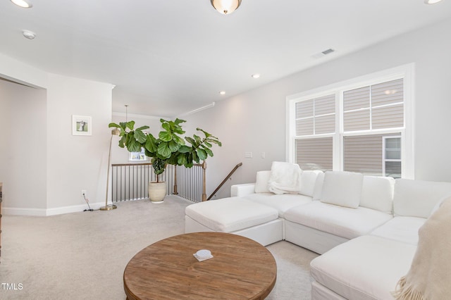 2128 Jollay St, Durham, NC 27703 - living area featuring light colored carpet, recessed lighting, and baseboards