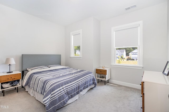 2128 Jollay St, Durham, NC 27703 - bedroom with light carpet and baseboards