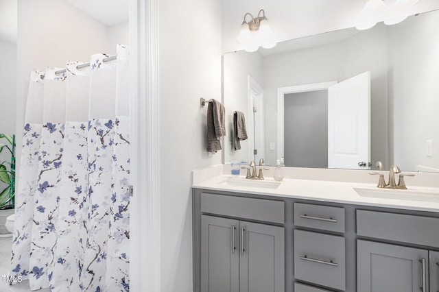 2128 Jollay St, Durham, NC 27703 - full bathroom featuring double vanity, toilet, and curtained shower