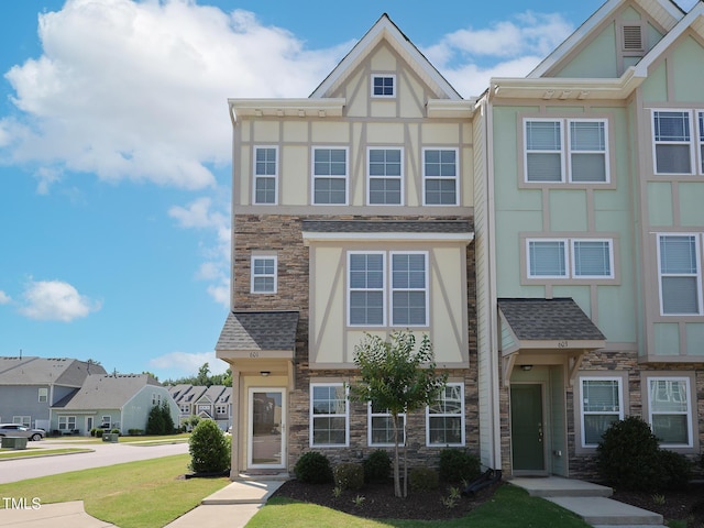 601 Grand Central Sta, Apex, NC 27502 - multi unit property with stone siding, stucco siding, a front lawn, and roof with shingles