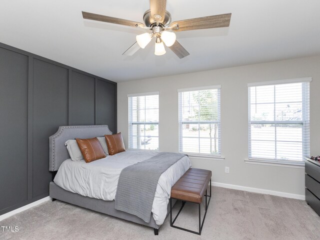 601 Grand Central Sta, Apex, NC 27502 - bedroom featuring baseboards, light carpet, and a ceiling fan