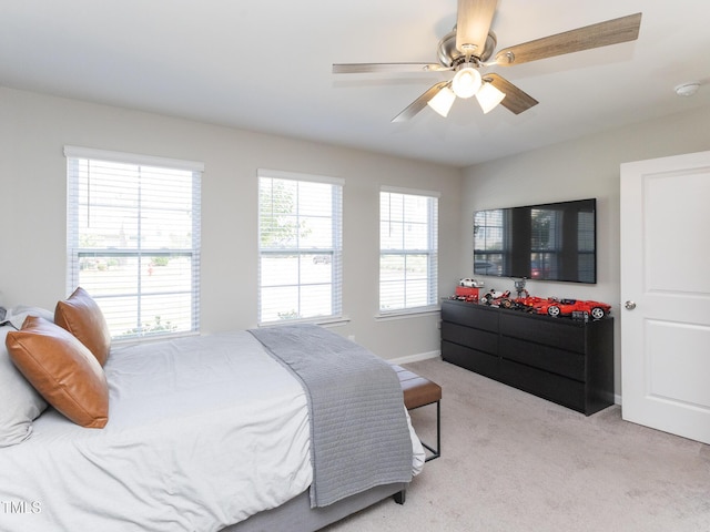 601 Grand Central Sta, Apex, NC 27502 - bedroom with light colored carpet, baseboards, and a ceiling fan
