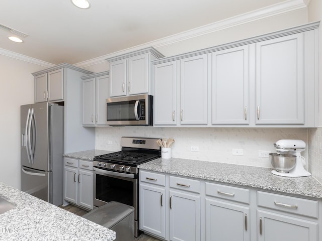 601 Grand Central Sta, Apex, NC 27502 - kitchen featuring appliances with stainless steel finishes, crown molding, backsplash, light stone countertops, and recessed lighting