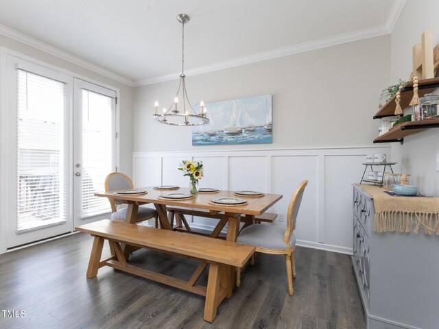 601 Grand Central Sta, Apex, NC 27502 - dining space with ornamental molding, a chandelier, a wainscoted wall, and dark wood-style flooring