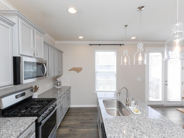 601 Grand Central Sta, Apex, NC 27502 - kitchen featuring appliances with stainless steel finishes, a sink, backsplash, crown molding, and dark wood-type flooring