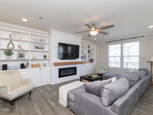 601 Grand Central Sta, Apex, NC 27502 - living area with a fireplace, dark wood-type flooring, ceiling fan, crown molding, and recessed lighting