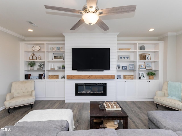 601 Grand Central Sta, Apex, NC 27502 - living area with wood finished floors, ornamental molding, a ceiling fan, a large fireplace, and recessed lighting