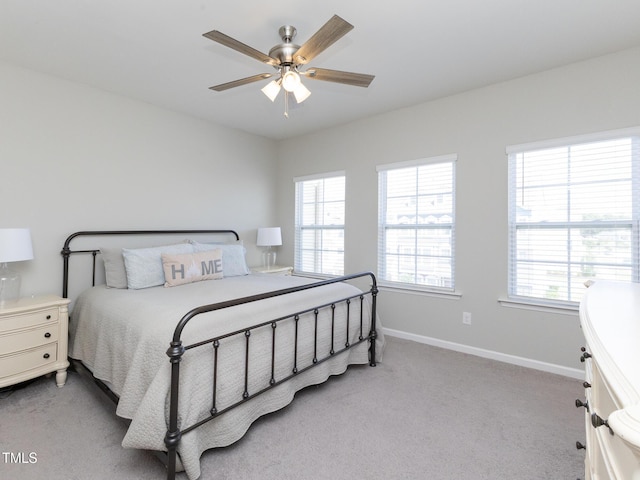 601 Grand Central Sta, Apex, NC 27502 - bedroom with light colored carpet, multiple windows, baseboards, and a ceiling fan