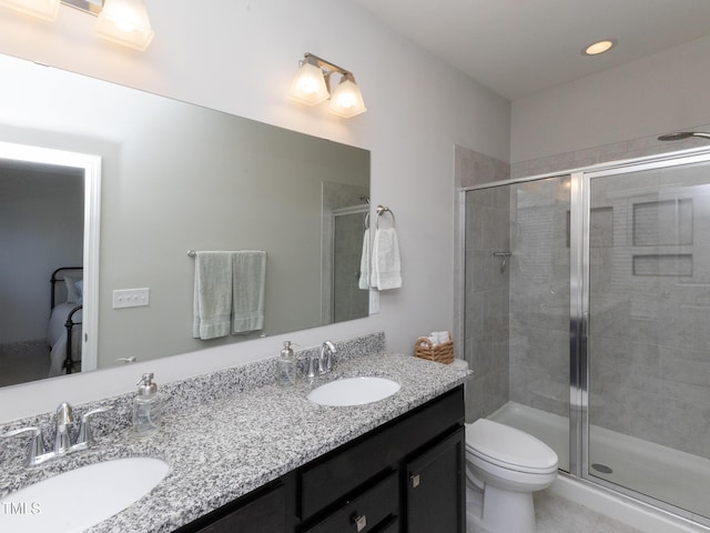 601 Grand Central Sta, Apex, NC 27502 - bathroom featuring double vanity, a stall shower, and toilet