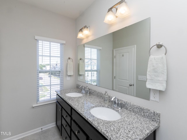 601 Grand Central Sta, Apex, NC 27502 - full bath featuring double vanity, plenty of natural light, tile patterned floors, and baseboards