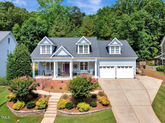 10809 Grassy Creek Pl, Raleigh, NC 27614 - view of front of house featuring a porch, concrete driveway, and an attached garage