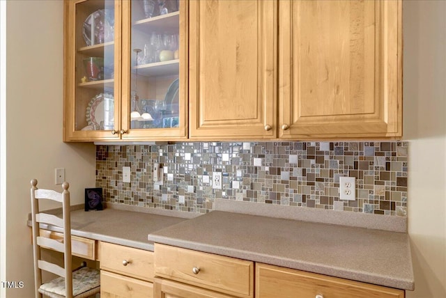 10809 Grassy Creek Pl, Raleigh, NC 27614 - kitchen with light brown cabinetry, decorative backsplash, light countertops, and glass insert cabinets