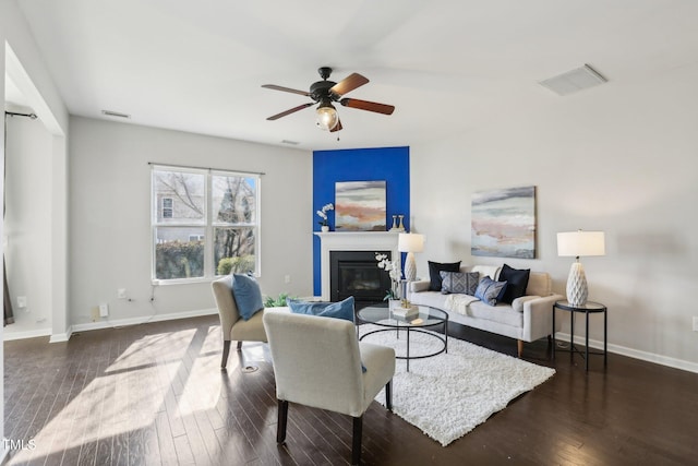 8204 Yaxley Hall Dr, Raleigh, NC 27616 - living room featuring ceiling fan, baseboards, wood finished floors, and a glass covered fireplace