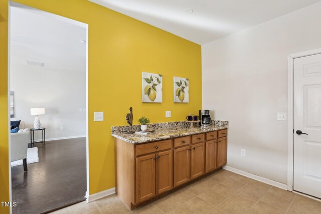 8204 Yaxley Hall Dr, Raleigh, NC 27616 - bar area featuring baseboards
