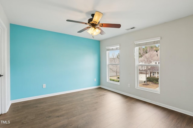 8204 Yaxley Hall Dr, Raleigh, NC 27616 - empty room featuring dark wood-type flooring, ceiling fan, and baseboards