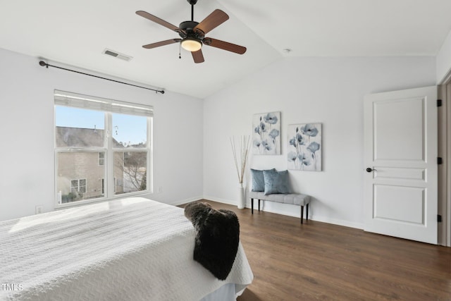 8204 Yaxley Hall Dr, Raleigh, NC 27616 - bedroom featuring vaulted ceiling, dark wood-style flooring, baseboards, and ceiling fan