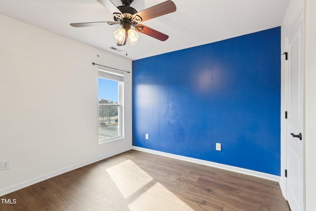 8204 Yaxley Hall Dr, Raleigh, NC 27616 - spare room with wood finished floors, baseboards, and ceiling fan