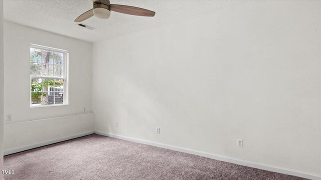 2396 Spring Valley Rd, Henderson, NC 27537 - carpeted empty room featuring a textured ceiling, ceiling fan, and baseboards