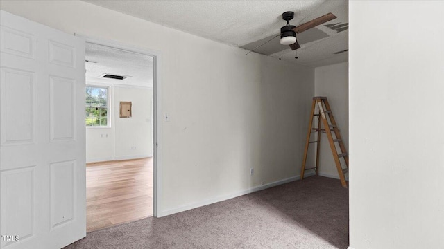 2396 Spring Valley Rd, Henderson, NC 27537 - spare room with a ceiling fan, carpet, and a textured ceiling