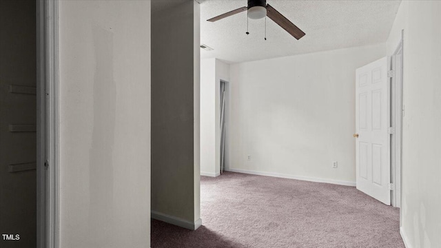 2396 Spring Valley Rd, Henderson, NC 27537 - spare room featuring carpet floors, ceiling fan, baseboards, and a textured ceiling