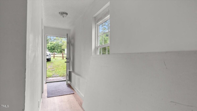 2396 Spring Valley Rd, Henderson, NC 27537 - doorway featuring wood finished floors and a textured ceiling
