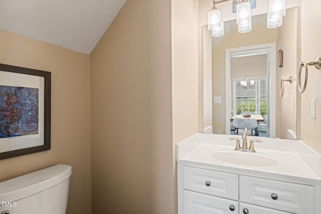 1 Lake Hill Dr, Durham, NC 27713 - bathroom with toilet, vanity, and vaulted ceiling