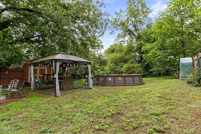 819 Corbin St, Albemarle, NC 28001 - view of yard featuring an outdoor pool, an outdoor structure, and a gazebo