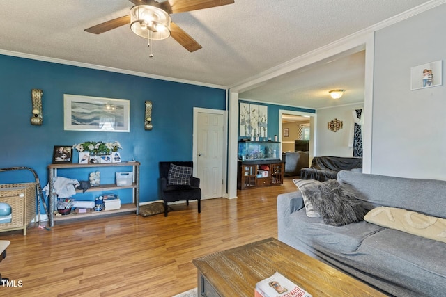 819 Corbin St, Albemarle, NC 28001 - living room with crown molding, a textured ceiling, wood finished floors, and a ceiling fan