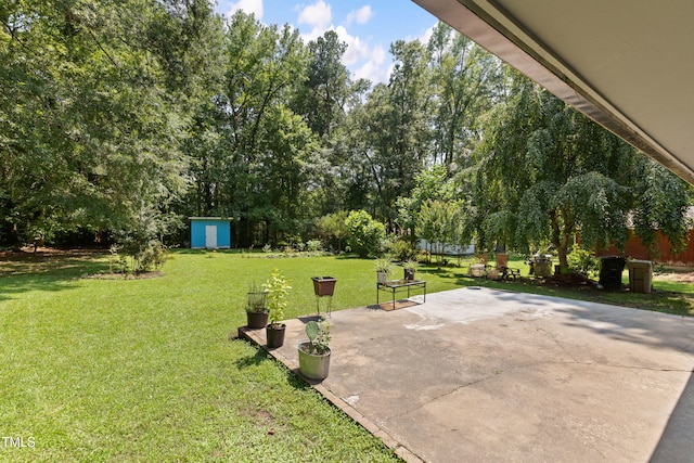 509 Forest Ridge Rd, Garner, NC 27529 - view of grassy yard featuring a patio and a storage unit