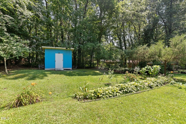 509 Forest Ridge Rd, Garner, NC 27529 - view of green lawn featuring a storage unit