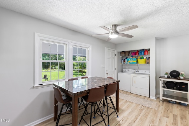 509 Forest Ridge Rd, Garner, NC 27529 - dining room with washing machine and clothes dryer, ceiling fan, light wood-type flooring, and a textured ceiling