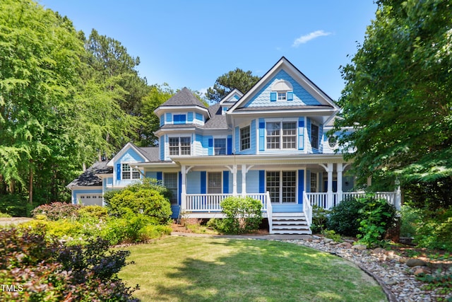 104 Shady Ridge Ct, Apex, NC 27502 - victorian-style house featuring a porch and a front lawn