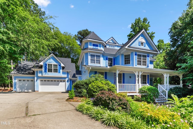 104 Shady Ridge Ct, Apex, NC 27502 - victorian home featuring driveway, a porch, and an attached garage