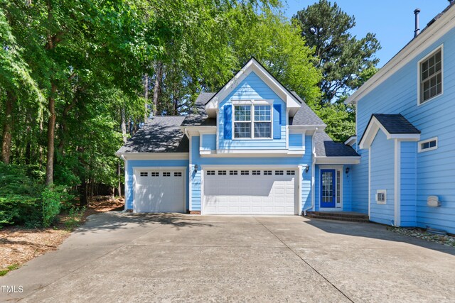 104 Shady Ridge Ct, Apex, NC 27502 - traditional-style house featuring concrete driveway, a shingled roof, and an attached garage