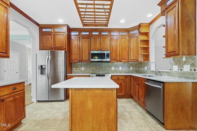 104 Shady Ridge Ct, Apex, NC 27502 - kitchen featuring appliances with stainless steel finishes, a sink, glass insert cabinets, a kitchen island, and backsplash