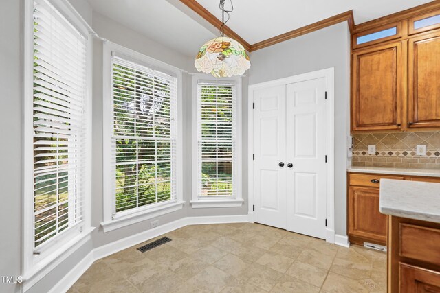 104 Shady Ridge Ct, Apex, NC 27502 - unfurnished dining area with healthy amount of natural light, ornamental molding, baseboards, and light tile patterned floors