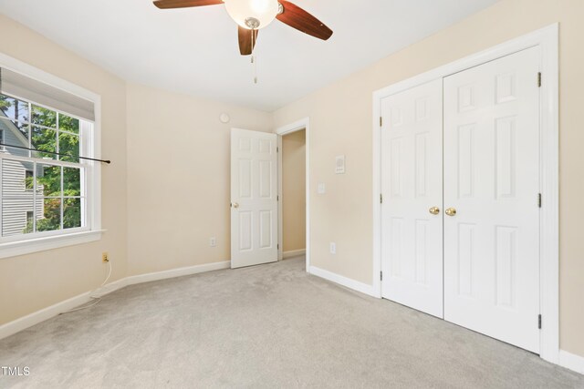104 Shady Ridge Ct, Apex, NC 27502 - unfurnished bedroom featuring light colored carpet, baseboards, and a closet