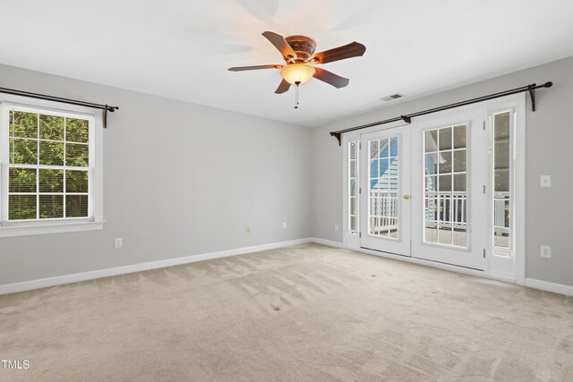 104 Shady Ridge Ct, Apex, NC 27502 - carpeted empty room with a ceiling fan, baseboards, and french doors