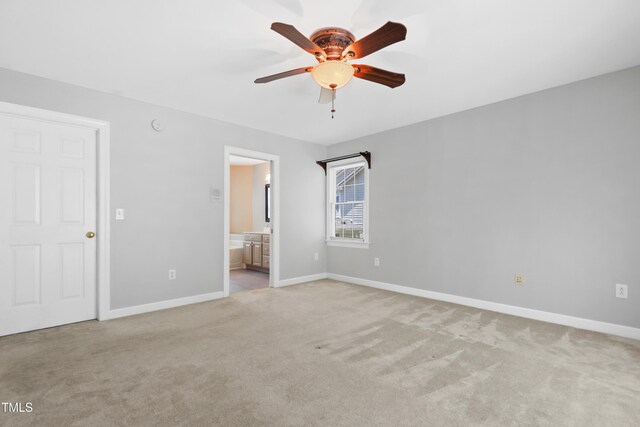 104 Shady Ridge Ct, Apex, NC 27502 - unfurnished bedroom with light carpet, baseboards, ensuite bathroom, and ceiling fan