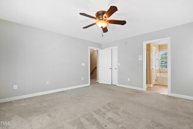 104 Shady Ridge Ct, Apex, NC 27502 - unfurnished bedroom with carpet, baseboards, ensuite bath, and ceiling fan