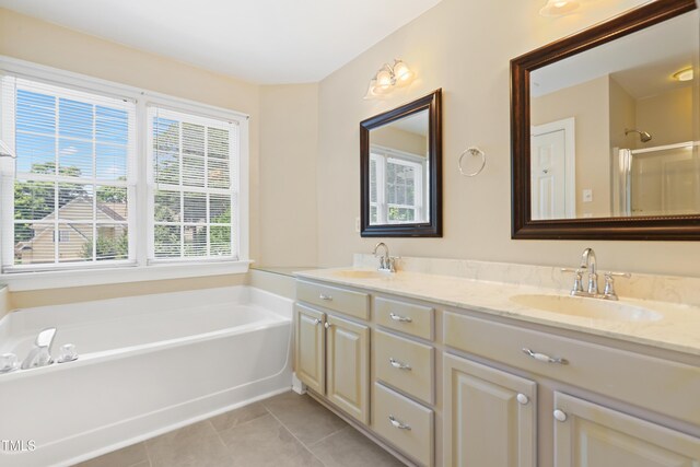 104 Shady Ridge Ct, Apex, NC 27502 - bathroom with double vanity, a garden tub, tile patterned floors, and a shower with door