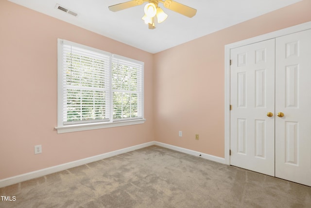 104 Shady Ridge Ct, Apex, NC 27502 - unfurnished bedroom with carpet flooring, baseboards, a closet, and ceiling fan