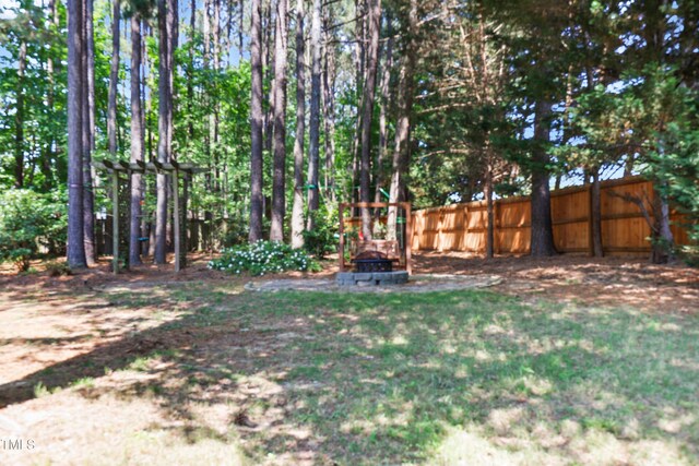 104 Shady Ridge Ct, Apex, NC 27502 - view of yard with an outdoor fire pit