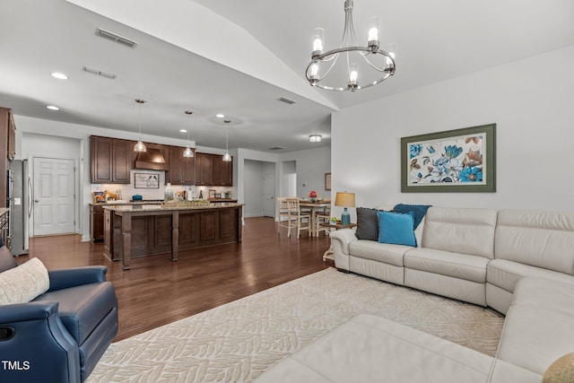 3032 Curling Creek Dr, Apex, NC 27502 - living area featuring a chandelier, dark wood finished floors, and recessed lighting