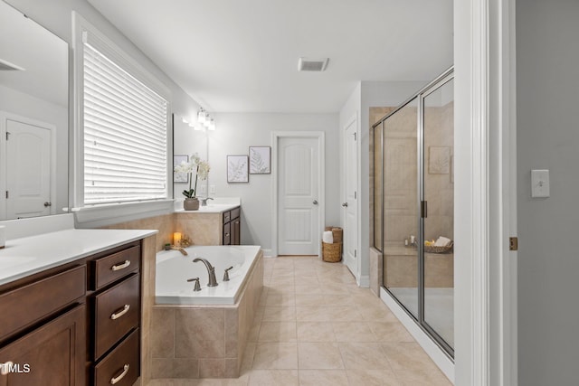 3032 Curling Creek Dr, Apex, NC 27502 - bathroom featuring vanity, a stall shower, a garden tub, and tile patterned floors