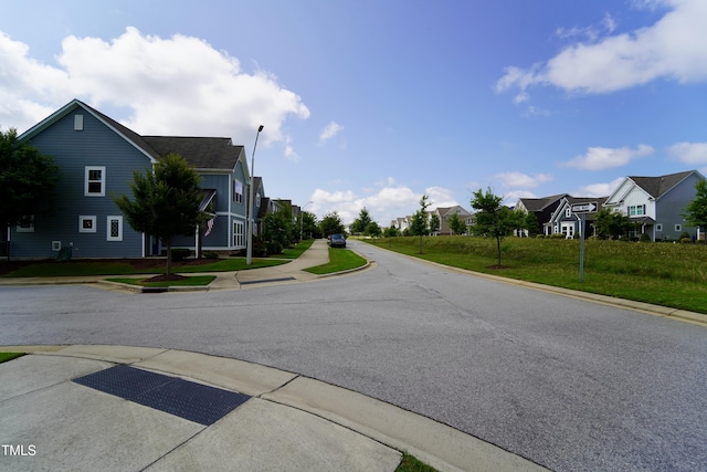 421 Old Ride Dr, Holly Springs, NC 27540 - view of asphalt road with a residential view, curbs, street lights, and sidewalks