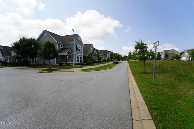 421 Old Ride Dr, Holly Springs, NC 27540 - view of asphalt street featuring curbs, a residential view, sidewalks, and street lighting