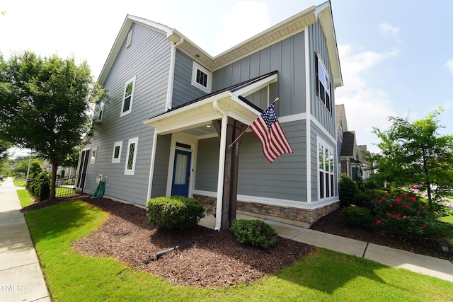 421 Old Ride Dr, Holly Springs, NC 27540 - view of front of property with board and batten siding and stone siding