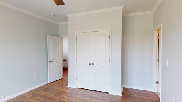 421 Old Ride Dr, Holly Springs, NC 27540 - unfurnished bedroom featuring crown molding, wood finished floors, a closet, baseboards, and ceiling fan